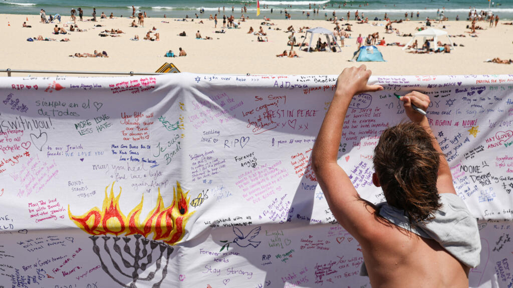Australia stops in silence for Bondi Beach shooting victims