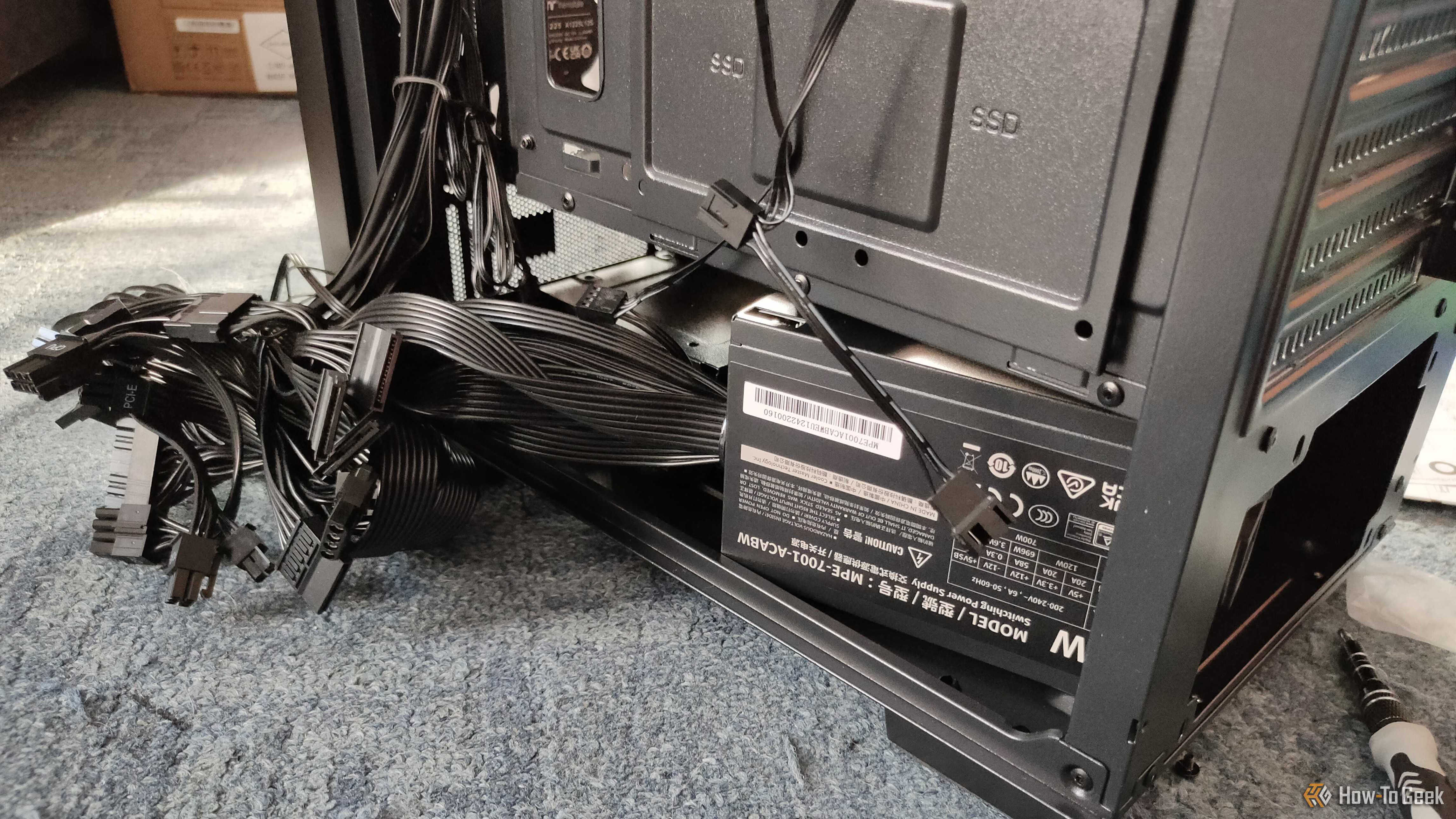 A power supply with a bunch fo cables sticking out.