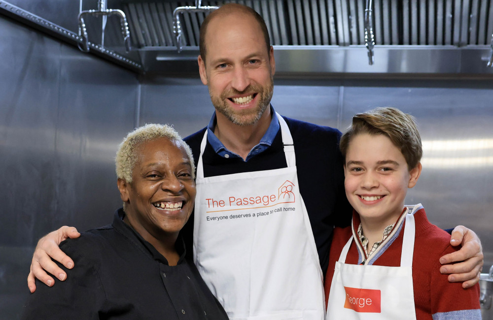 Prince George helps serve Christmas dinner at homeless charity