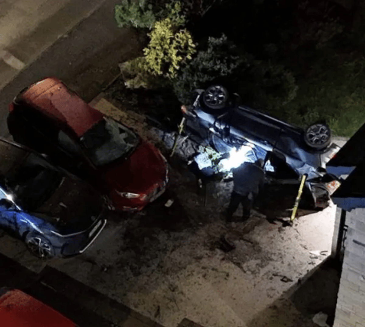 Teen killed and four arrested after car crashes and flips in garden