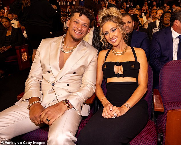 Mahomes, pictured alongside wife Brittany, now faces a tough period of rehabilitation
