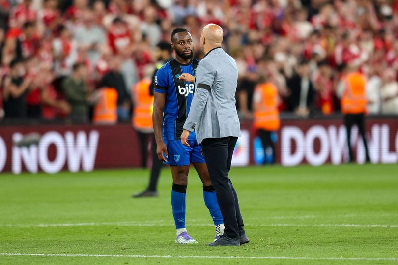 LIVERPOOL, ENGLAND - AUGUST 15: Head Coach Arne Slot of Liverpool with Antoine Semenyo of Bournemouth who scored both his sides goals at the end of Bournemouth's 4-2 defeat during the Premier League match between Liverpool and Bournemouth at Anfield on August 15, 2025 in Liverpool, England. (Photo by Robin Jones - AFC Bournemouth/AFC Bournemouth via Getty Images)