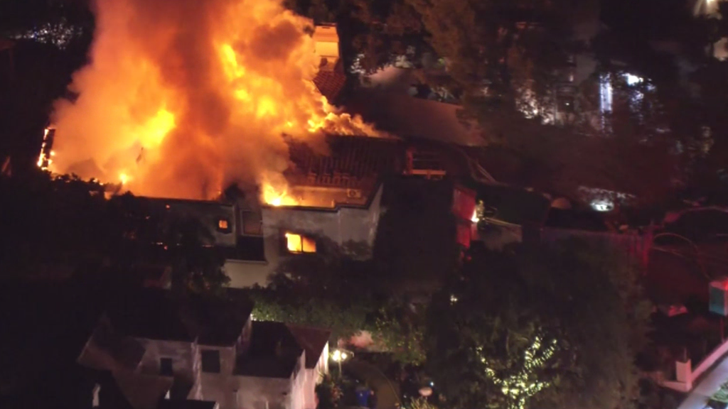 Los Angeles firefighters extinguish massive fire at vacant Chatsworth home