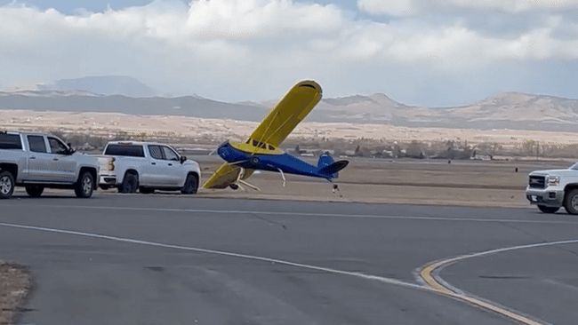 Light aircraft flips over in high winds