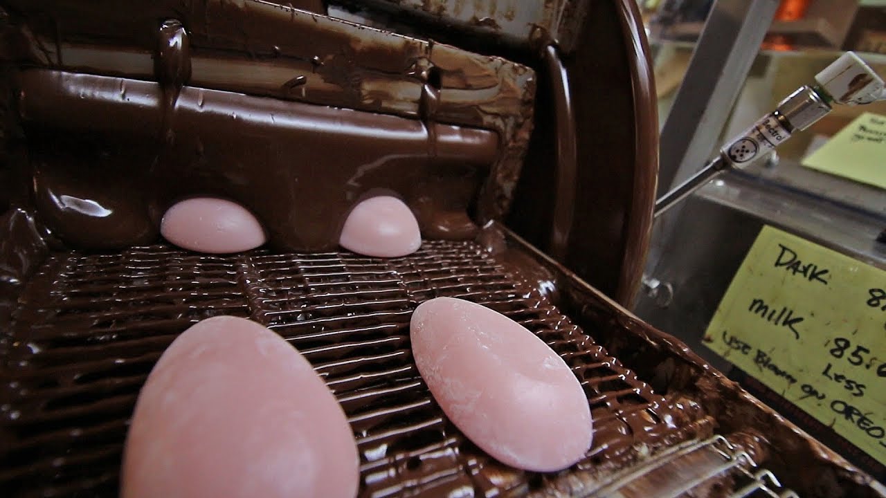 Enrobing raspberry eggs and watching the glossy finish set