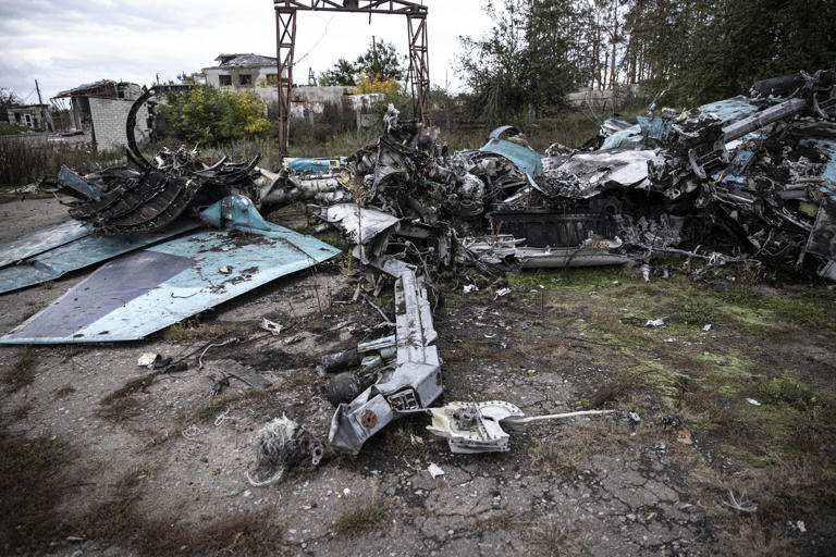 Ukraine said it sneaked into a guarded Russian airbase and destroyed 2 ...