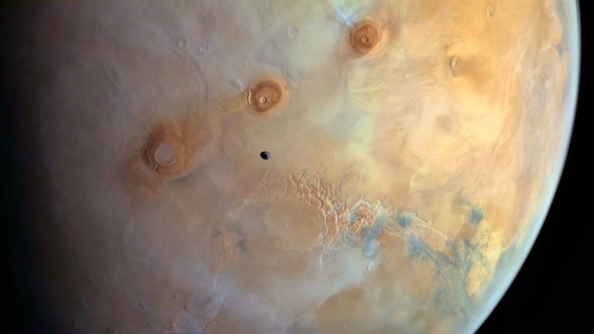 Martian moon Phobos looks like a tiny rock flying above red planet. See ...