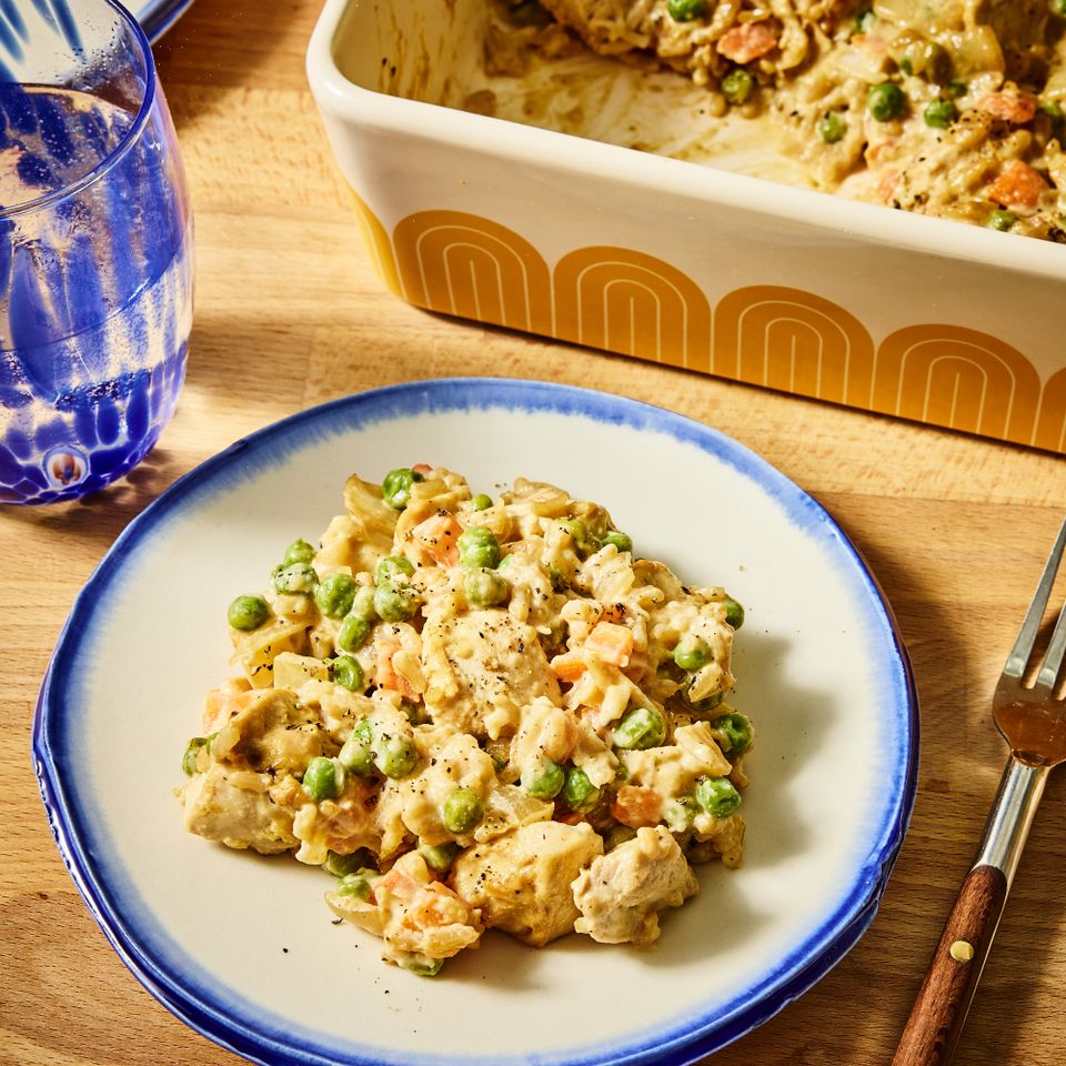 A dish of creamy honey mustard chicken casserole with vegetables served on a plate