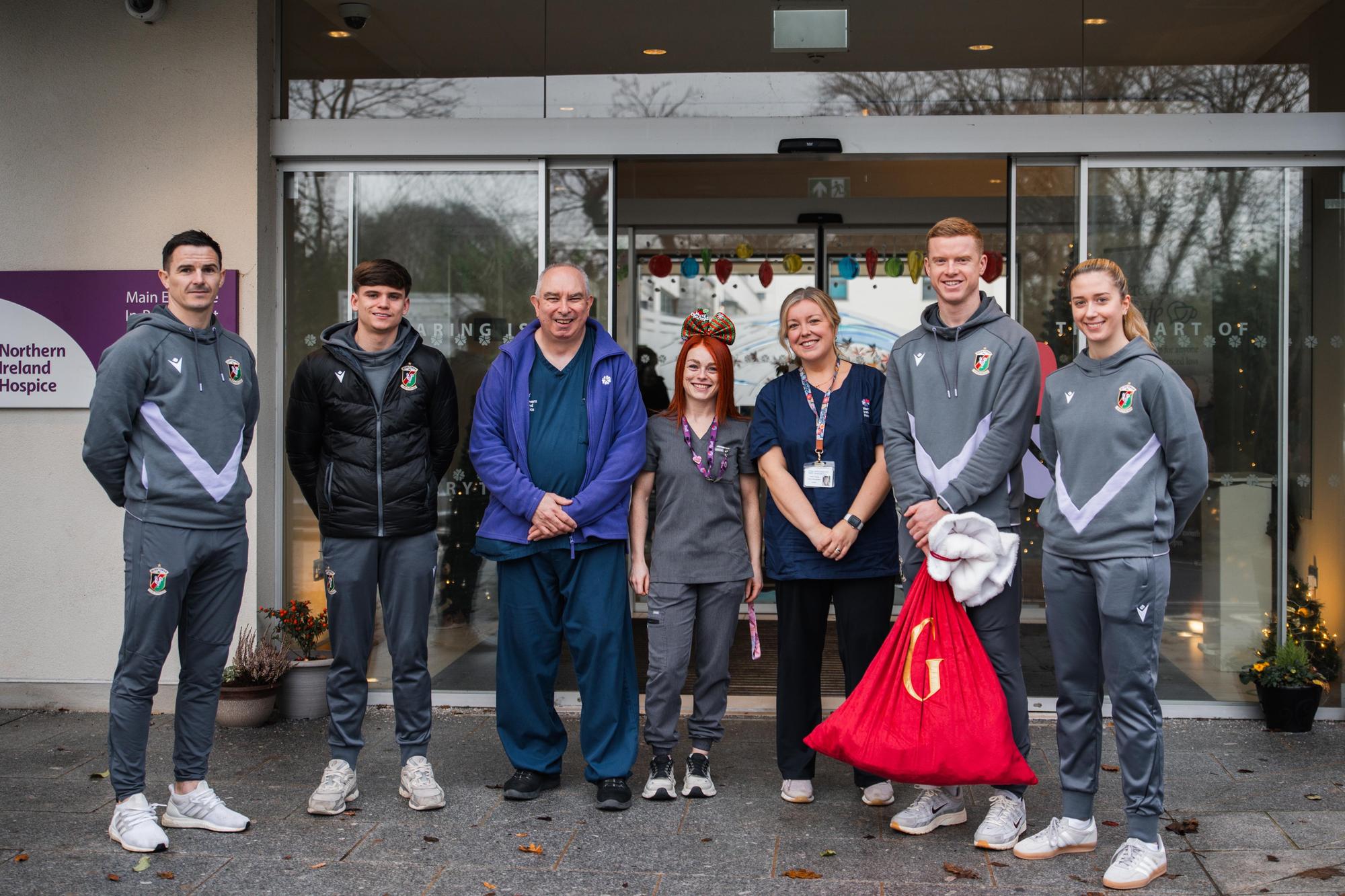 Glentoran players continue to spread Christmas cheer with visit to ...