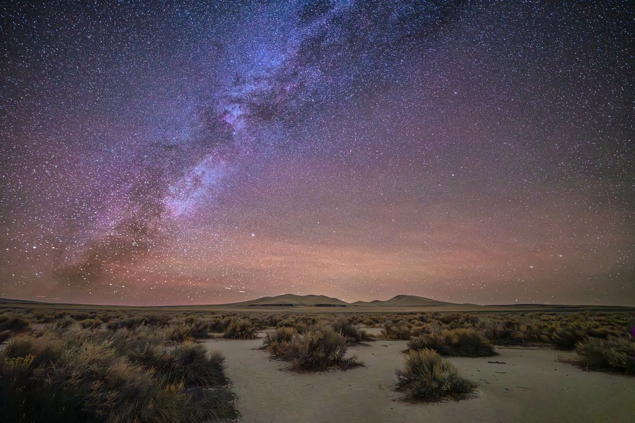 Night desert landscape with the Milky Way rise