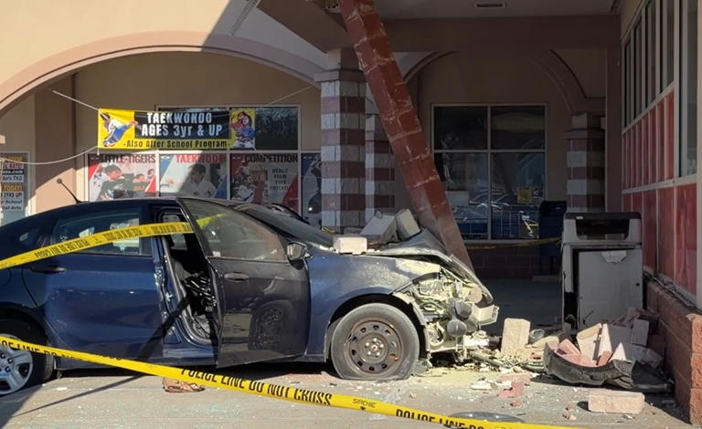 2 people taken to hospital after car crashes into CVS on North Shore