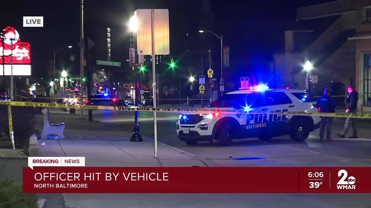 Baltimore police officer hospitalized after being struck by car