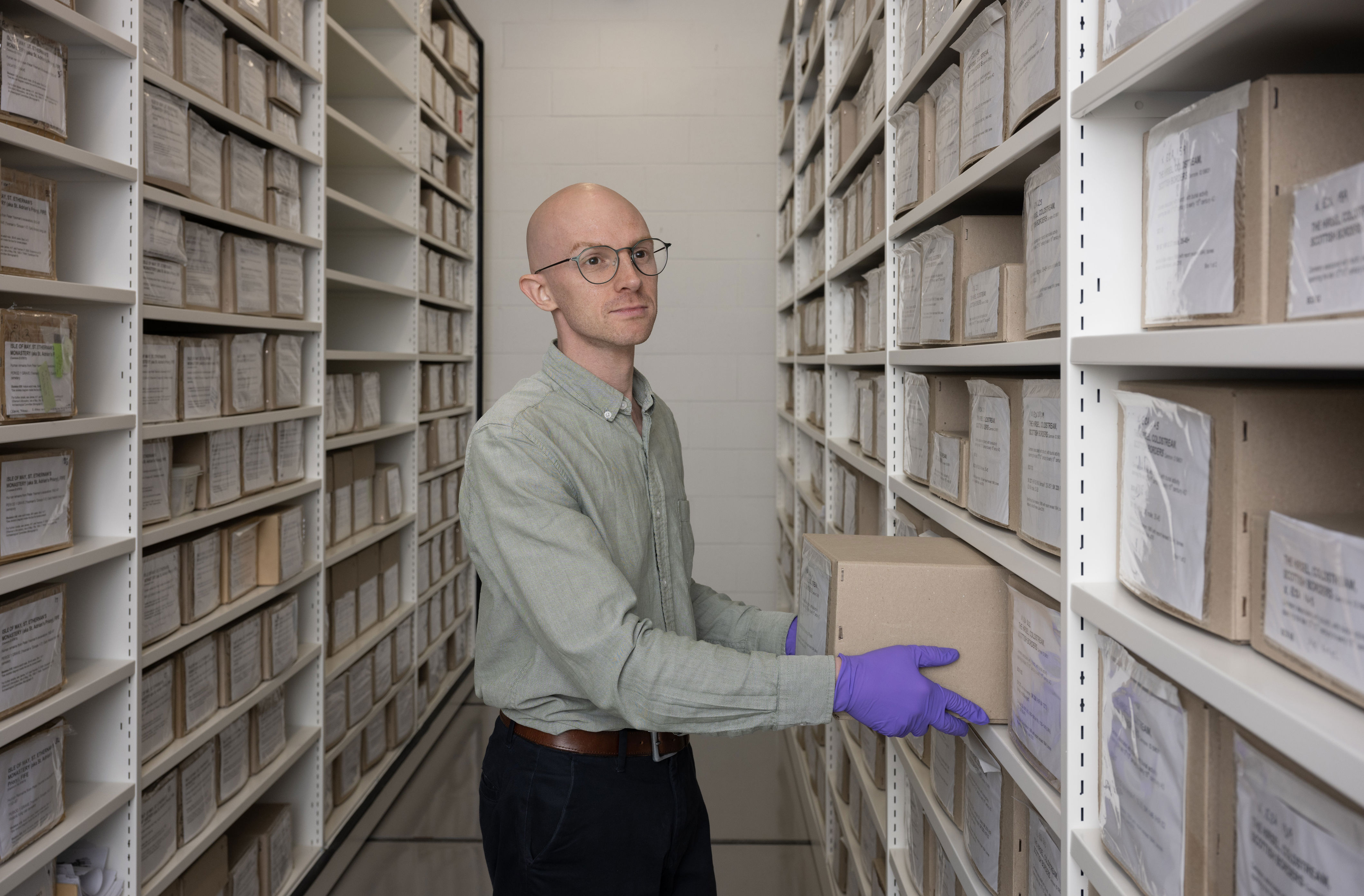 Dr Matthew Knight in the facility at the National Museums Collection Centre (Neil Hanna/ Historic Environment Scotland and AOC Archaeology Group/PA) (PA Media)