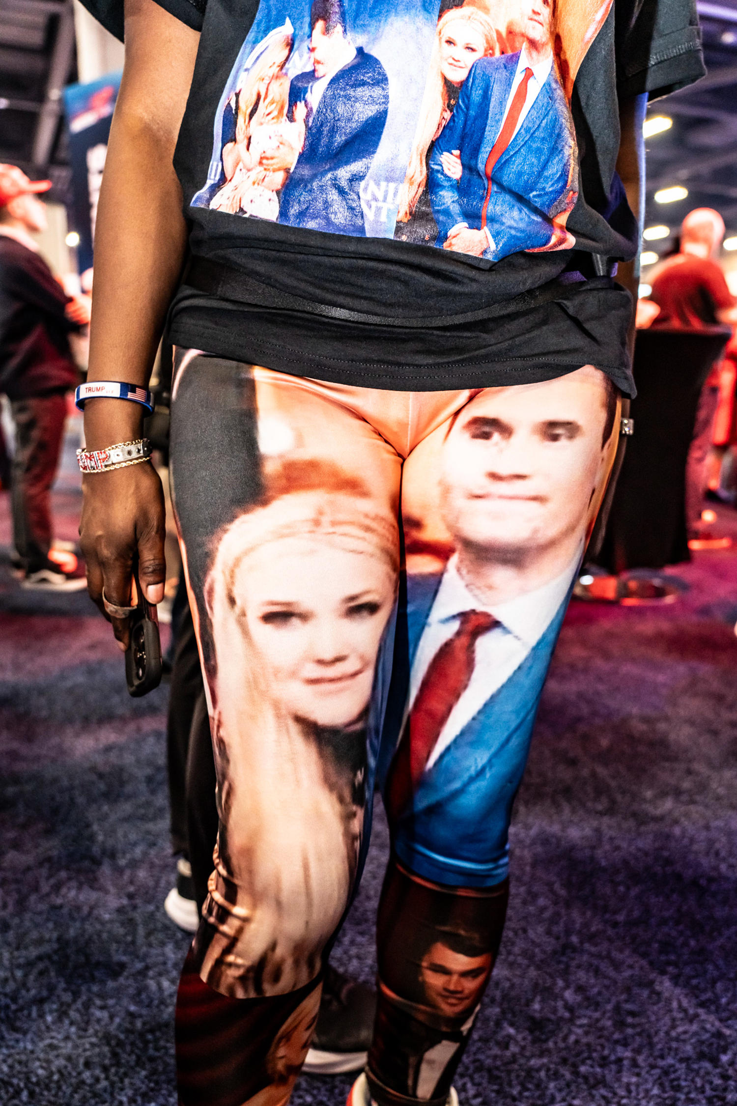 An eventgoer wears a top and pants with Erika and Charlie Kirk on them. (Mark Peterson for NBC News)