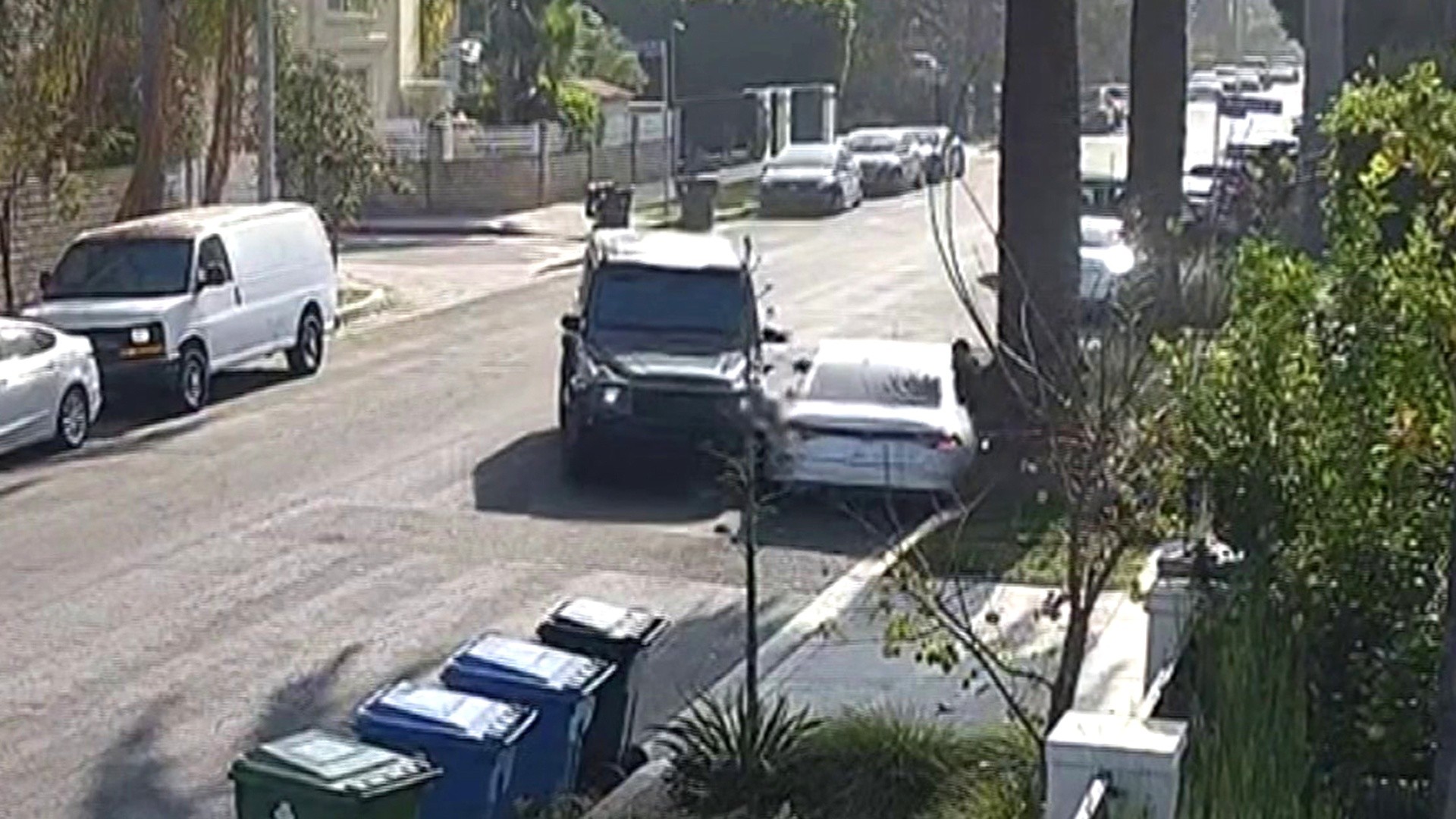 Mom rams SUV into burglar