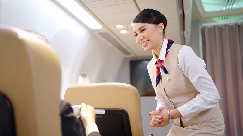 One thing flight attendants aren't allowed to do on a flight that ...