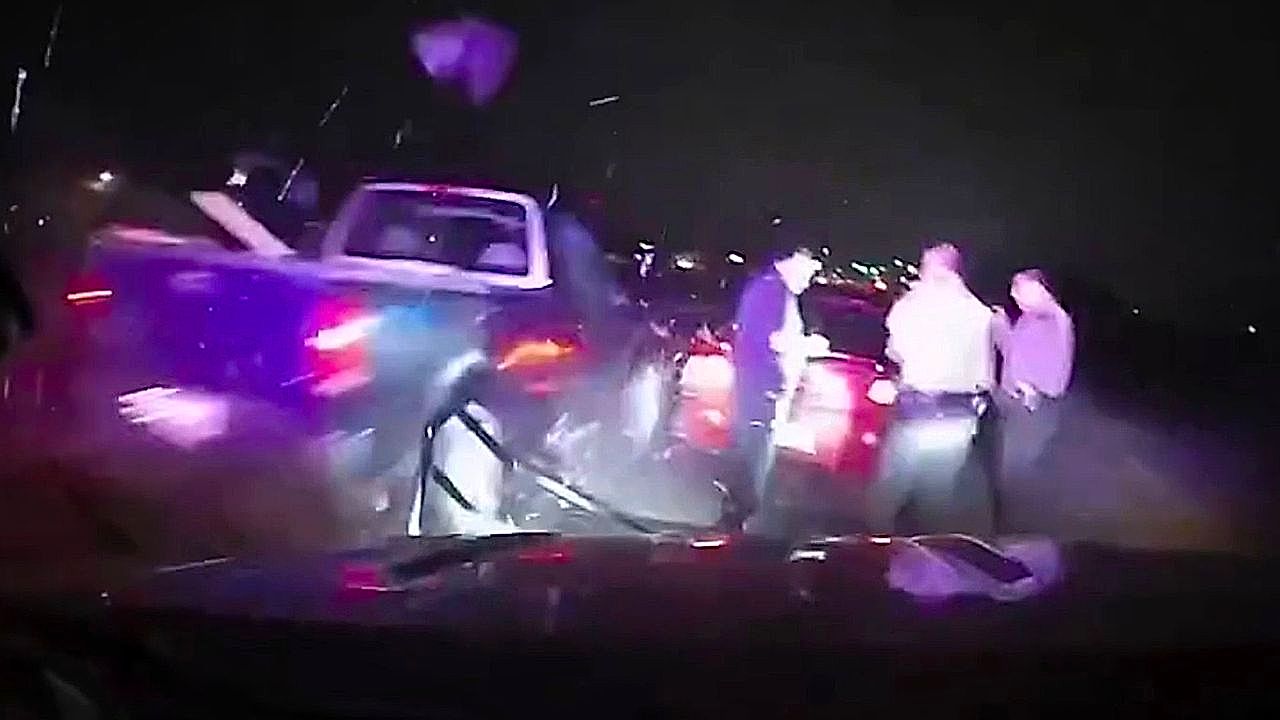 Routine traffic stop turns tense as passing truck clips sheriff's cruiser