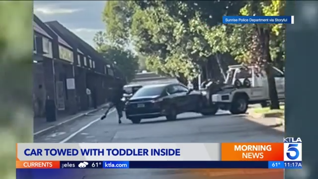 Tow truck driver arrested after towing car with toddler inside