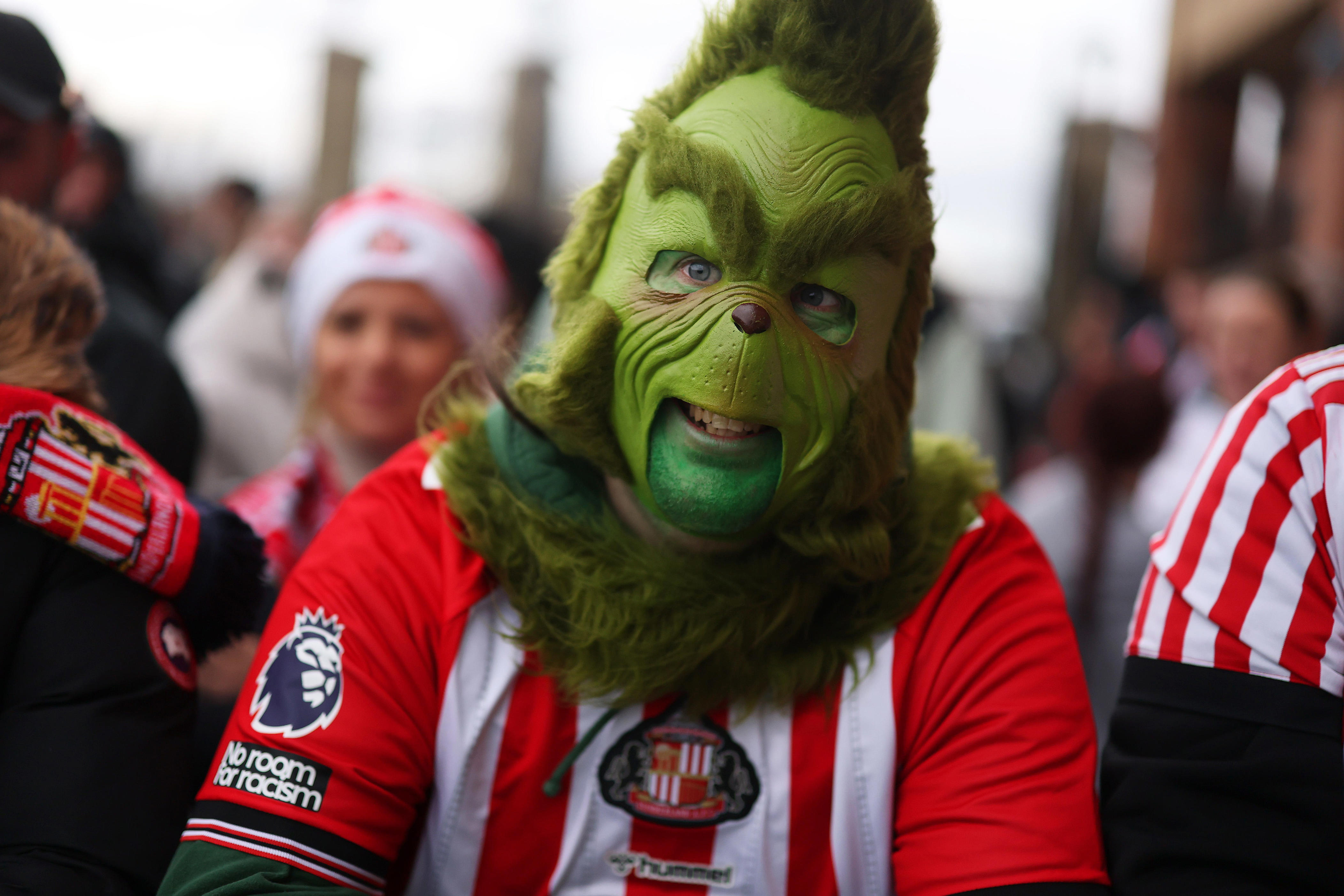 See photos of sports fans dressed as the Grinch ahead of Christmas