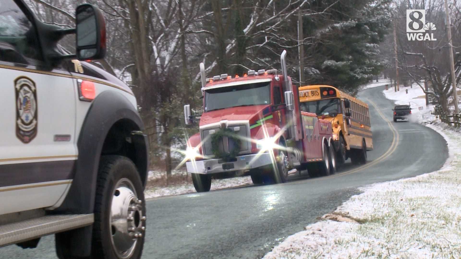 School bus slides down icy hill, knocks down tree | Video from the scene