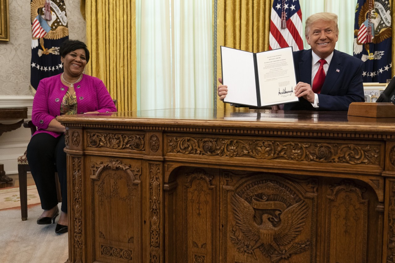 Trump and now-White House pardon czar Alice Johnson in August 2020 after he pardoned her for a nonviolent drug offense.