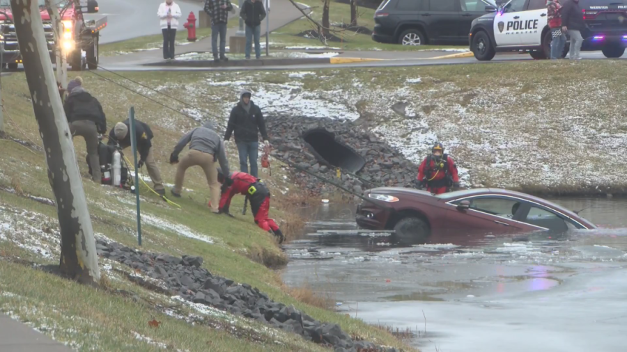 Woman in stable condition after car goes into Webster pond