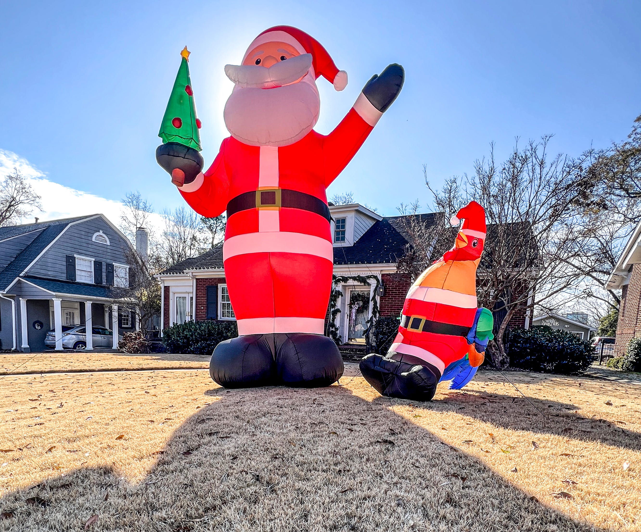 14-foot tall 'super magical' inflatable Santas spread holiday cheer