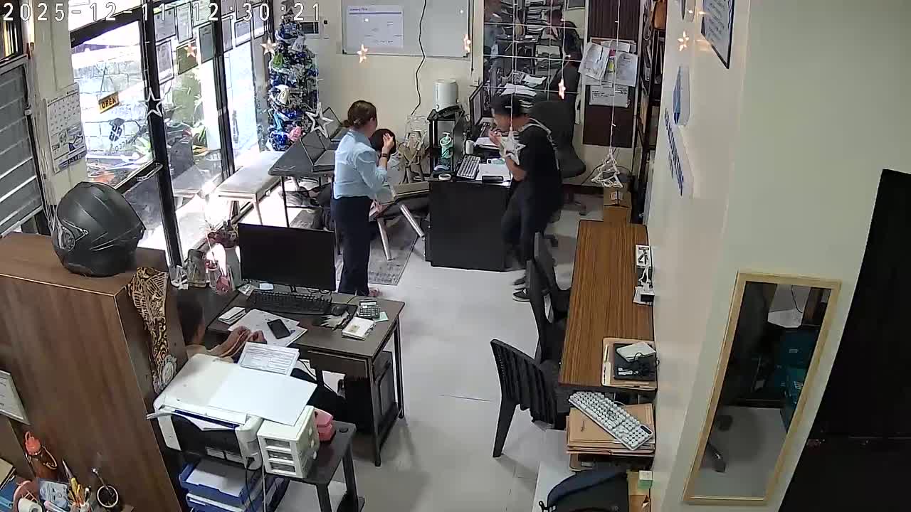 Bench collapses sending colleagues falling to ground