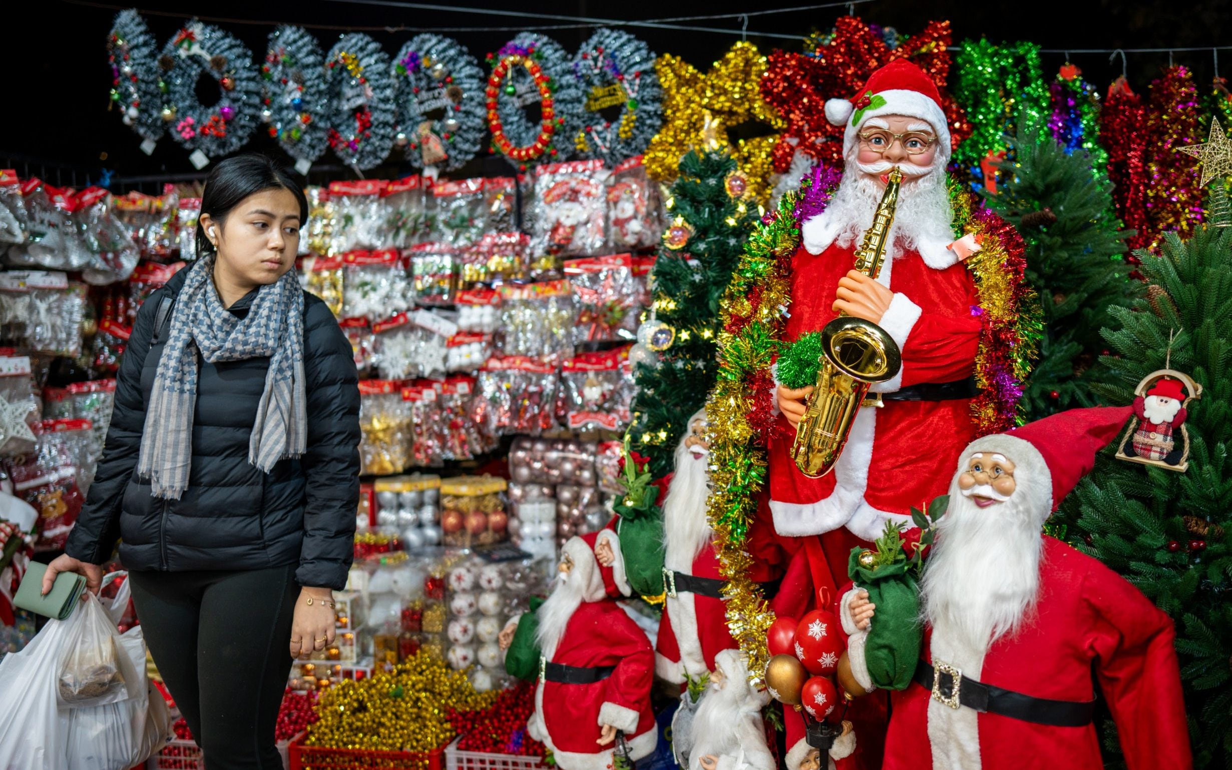Santa Claus figures outside a shop ahead of the Christmas festival in New Delhi, India - Amarjeet Kumar Singh/Getty Images