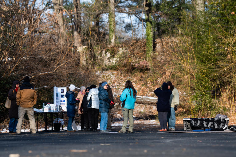 TAKOMA PARK, MD ‐ December 15: Locals and members of the St. Camillus Intercultural Choir sing in a parking lot that is typically used by ICE as a staging location in Takoma Park, MD on Monday December 15, 2025. Community organizers are gathering and scheduling events in the parking lot for the upcoming weeks to reclaim the space from ICE agents. (Photo by Demetrius Freeman/The Washington Post)