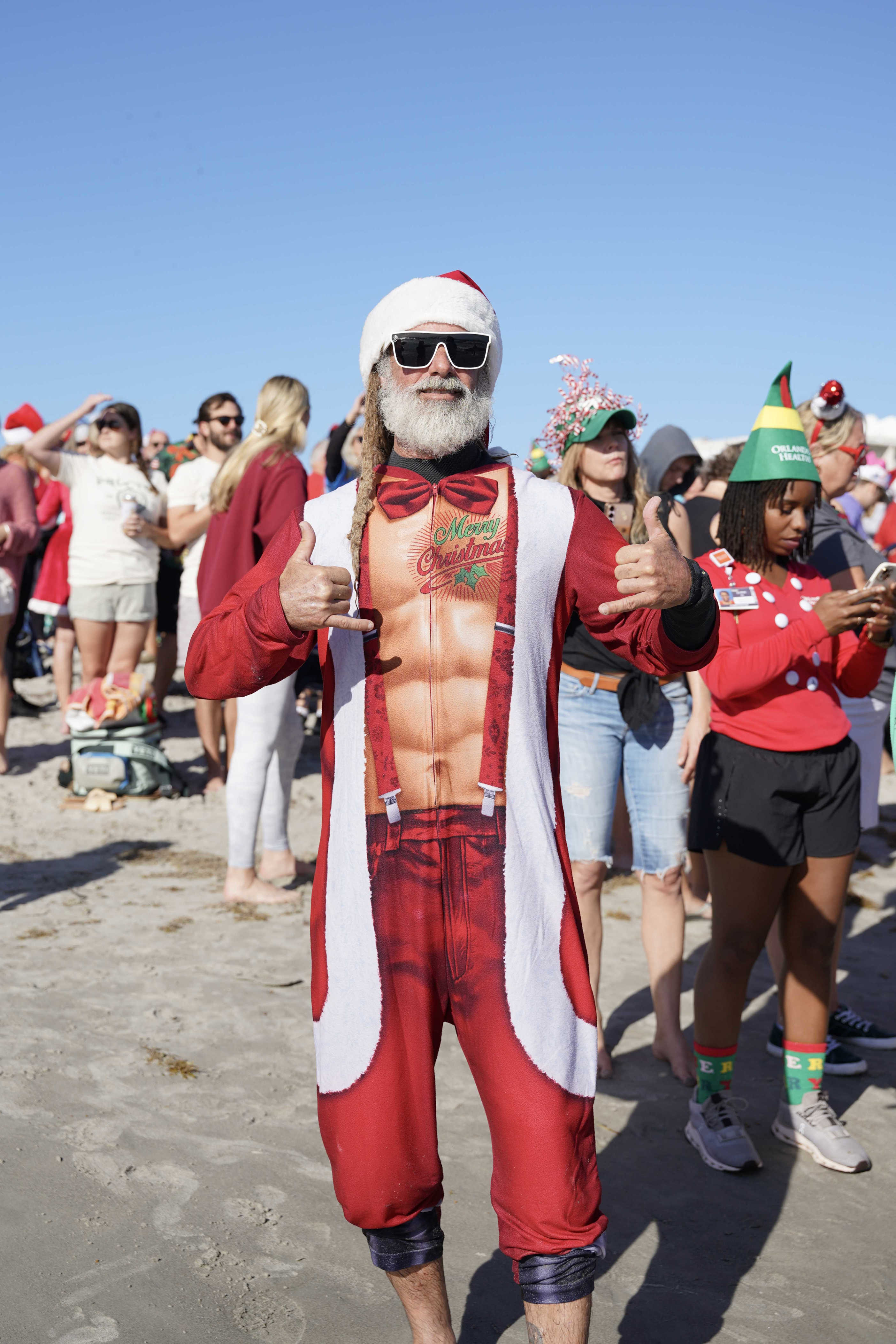 Dozens of Santas take over Cocoa Beach in annual surfing event