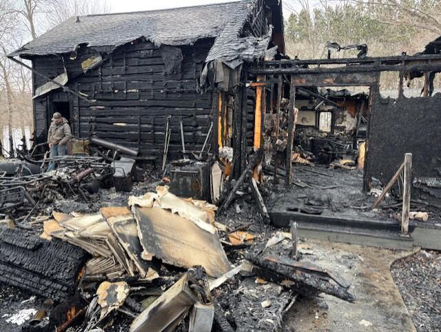 One firefighter hurt after fire damages home, garage near Sparta