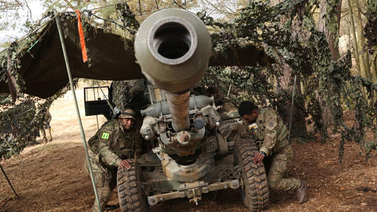 Soldiers of the 88th Gun Battery of the British Army prepare an artillery gun during the Allied Spirit 25 military exercise in Germany. - Sean Gallup/Getty Images