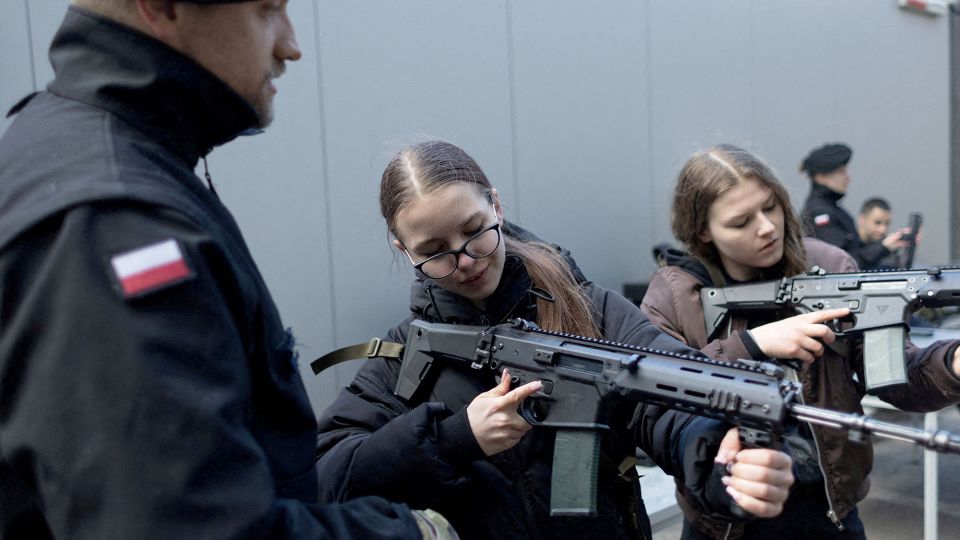 A group of civilians takes part in training military techniques in a session billed as "Train with the Army" by the country's defence ministry, in Gdynia, Poland, on April 5. - Lukasz Glowala/Reuters