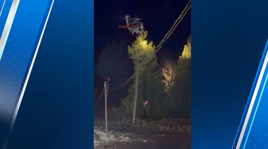 Watch: Two drivers stranded in floodwaters rescued by helicopter in ...