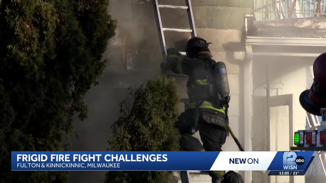 Milwaukee firefighters battle house fire in freezing conditions