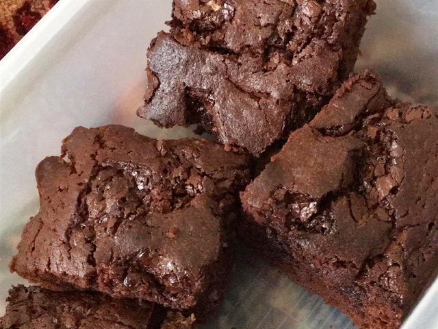 close up view of Chewy Brownies pieces in a container