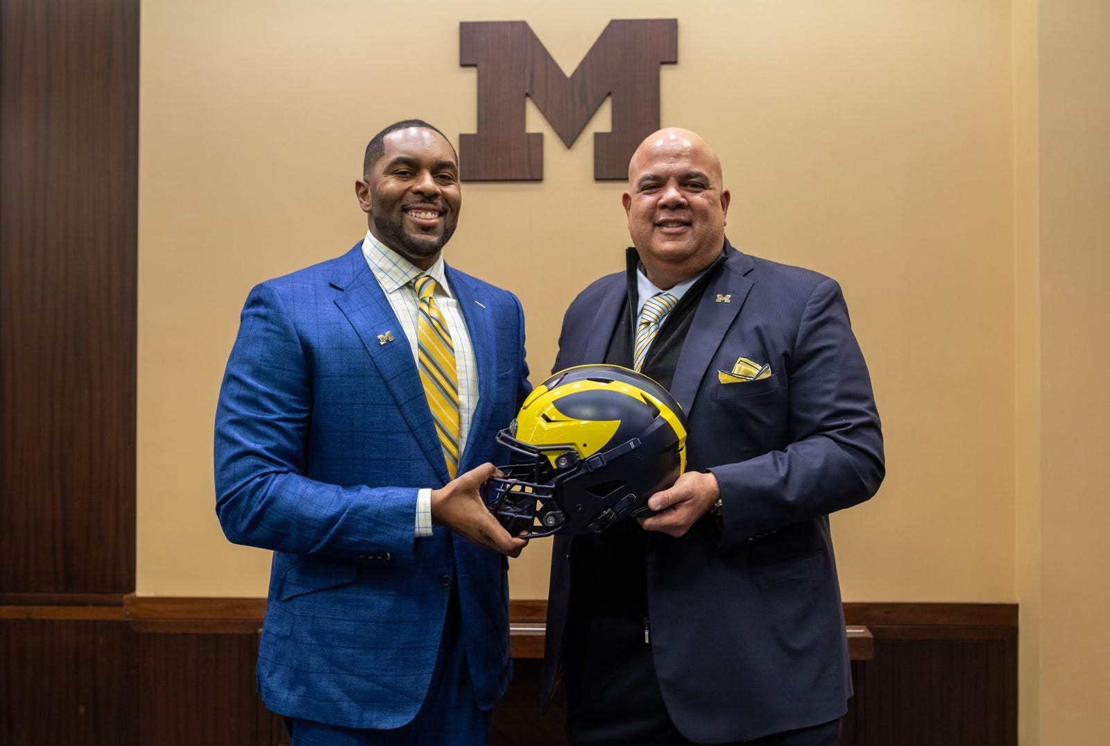 Sherrone Moore, head coach of the University of Michigan, stands next to Warde Manuel, Michigan's director of athletics, during a press conference inside the Junge Family Champions Center in Ann Arbor on Saturday, Jan. 27, 2024.