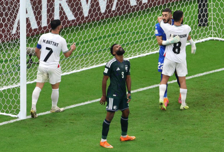 Saudi Arabia’s Firas Al-Buraikan reacts after Palestine’s Hamed Hamdan denied him the chance to open the scoring {Ibraheem Al Omari/Reuters]