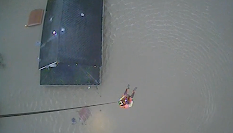 Watch: Coast Guard rescues 4 trapped in Washington home's attic during ...