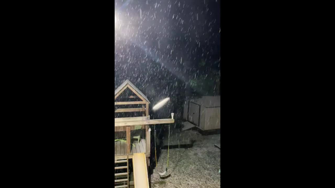 Pouring snow blankets front yard in Weber, Virginia, USA