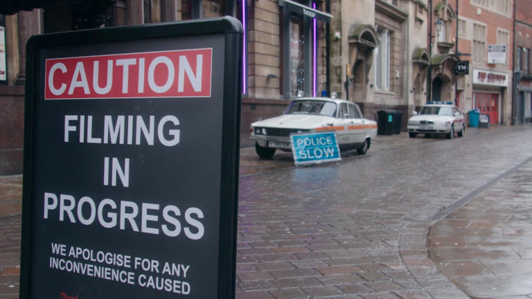Two Rover police cars are seen parked up outside the former Bob Carver's chip shop in Trinity House Lane