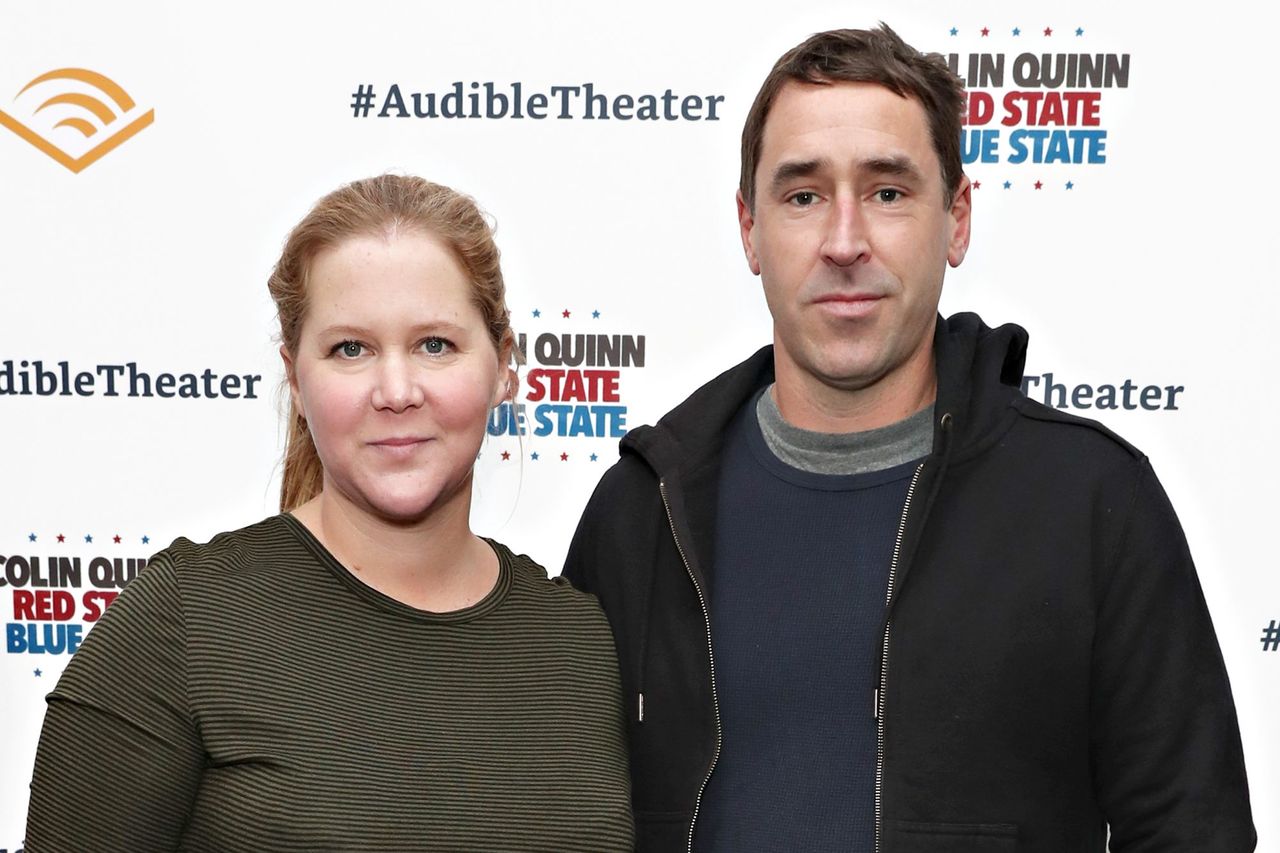 Cindy Ord/Getty Amy Schumer and her husband, Chris Fischer, in 2019