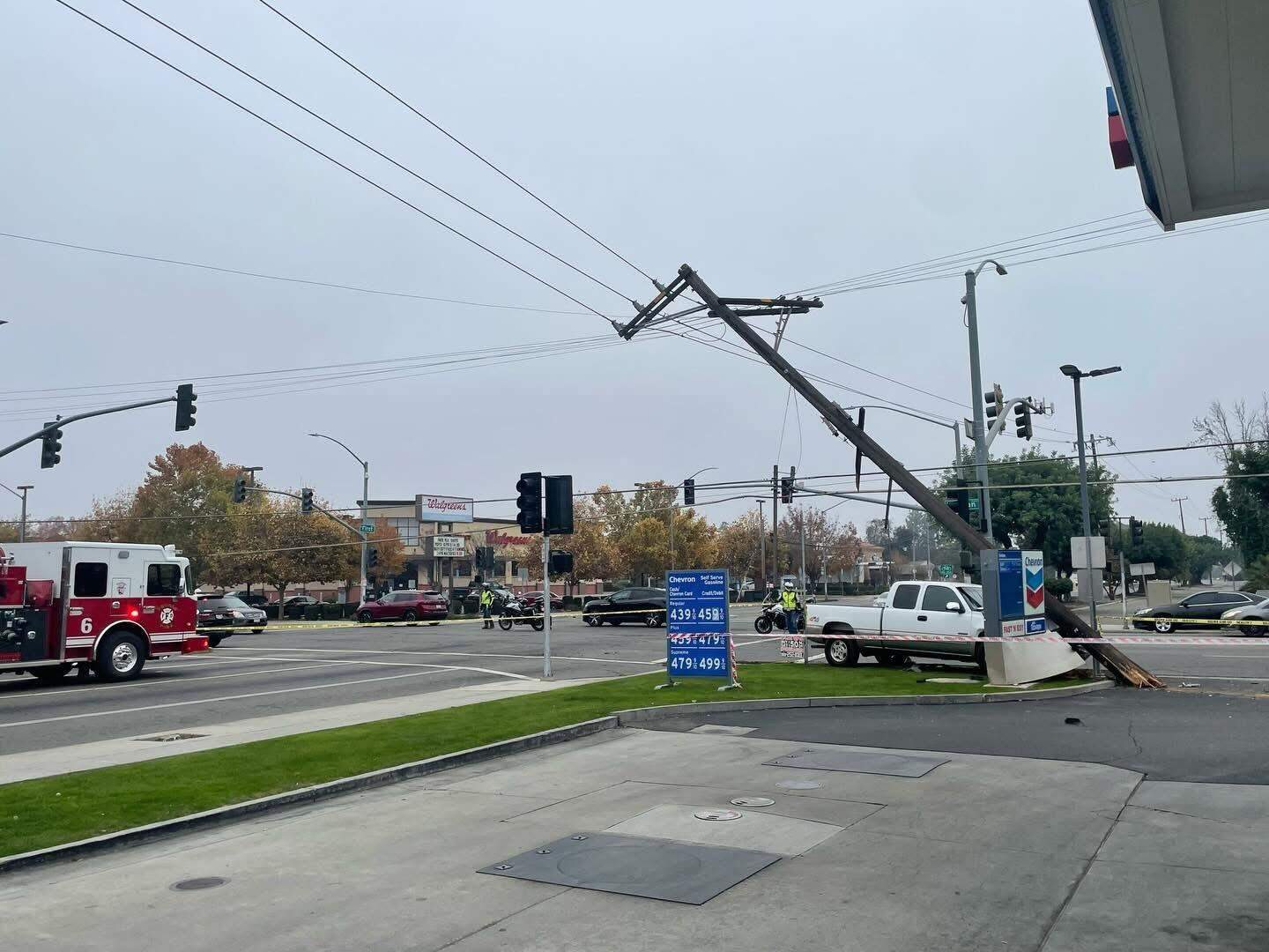 Vehicle crash causes power lines to come down at major Fresno intersection
