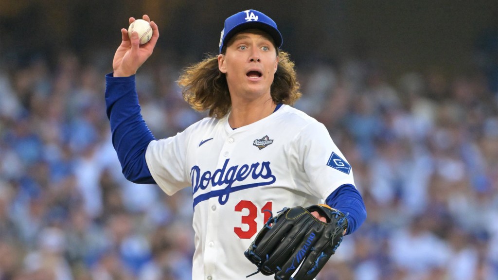 Oct 27, 2025; Los Angeles, California, USA; Los Angeles Dodgers pitcher Tyler Glasnow (31) throws to first for an out against Toronto Blue Jays second baseman Bo Bichette (11) in the second inning during game three of the 2025 MLB World Series at Dodger Stadium. Mandatory Credit: Jayne Kamin-Oncea-Imagn Images