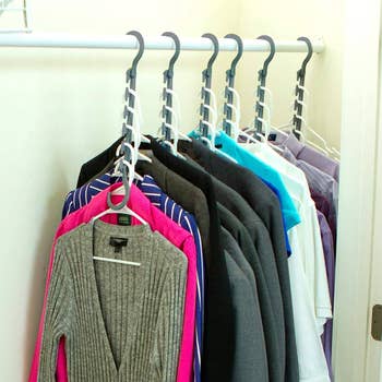 The same closet and clothes with hangers in a vertical position to show space saved