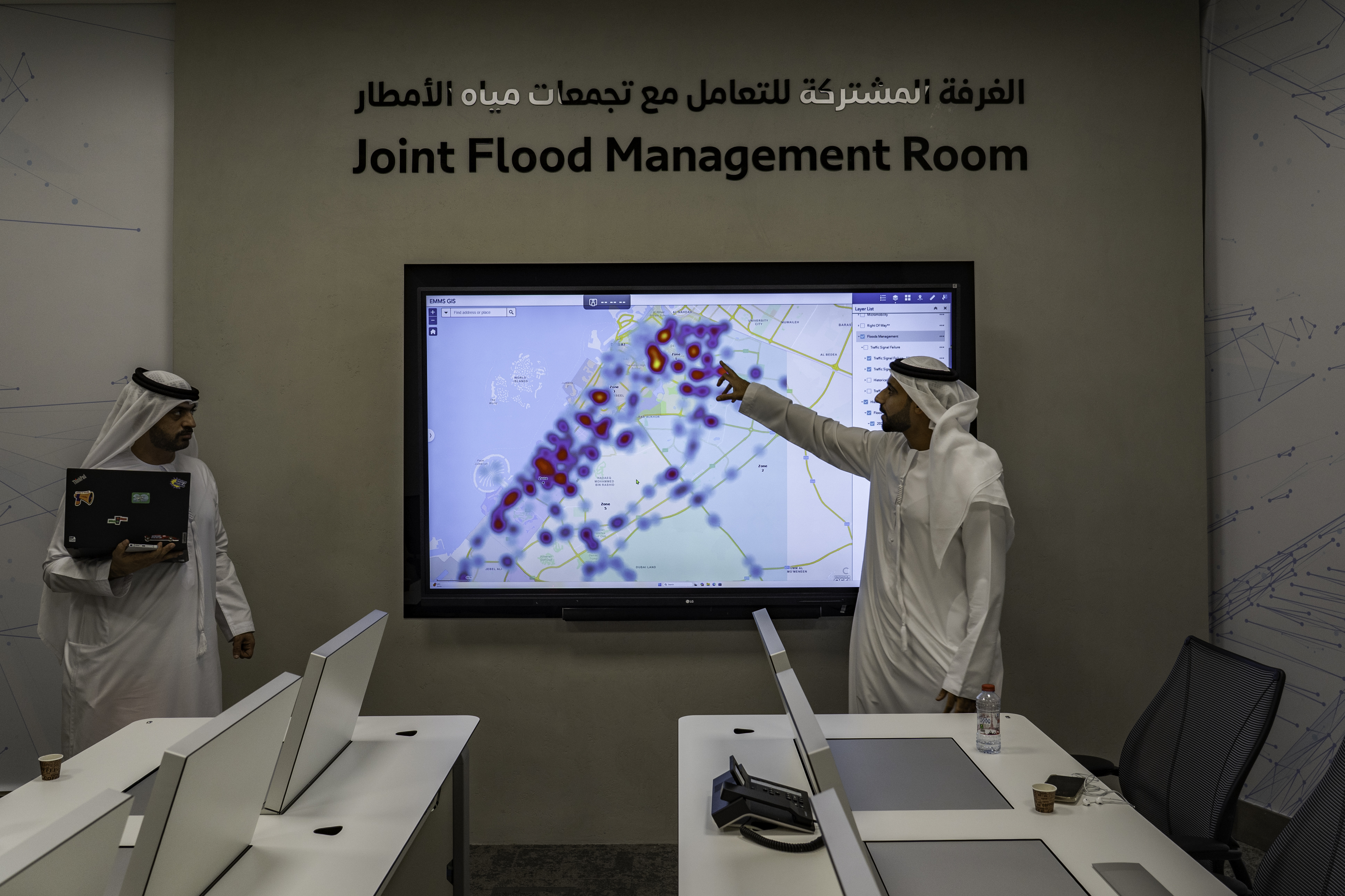 Hamad Ali Al-Shehhi, right, Director at Dubai’s Roads and Transport Authority, shows the areas that are being monitored in the Joint Flood Management Room in Dubai.