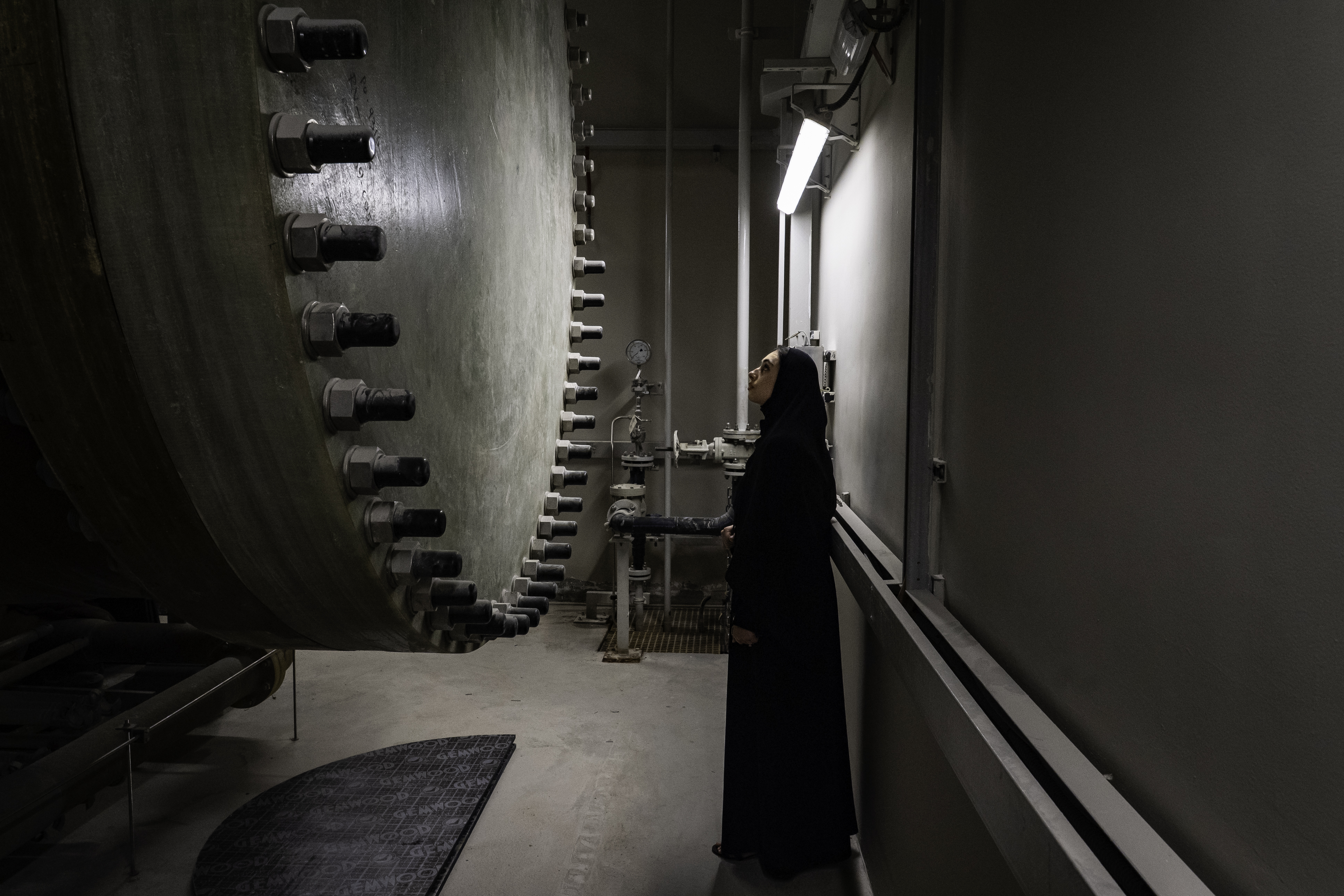 Aliya Ibraheem Alhosani, a senior electrical maintenance engineer at the Sewerage and Recycled Water Network Department next to the pipelines at the Dubai Municipality’s Tunnel Stormwater Management Center.