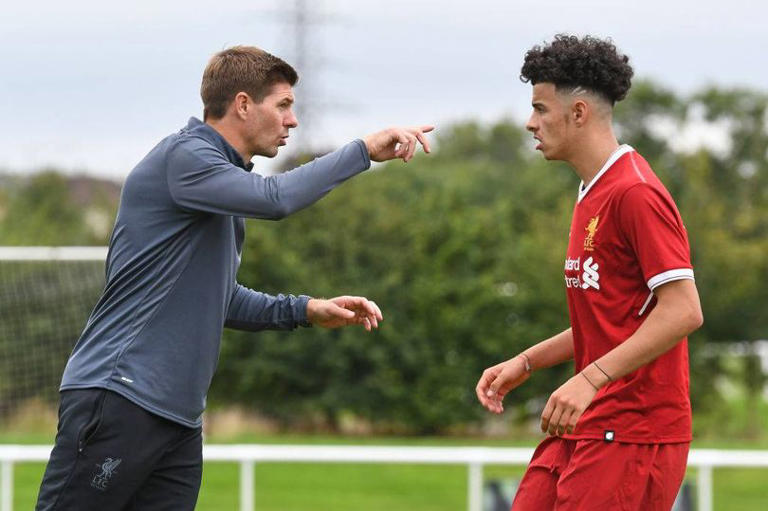 Steven Gerrard talks to Curtis Jones (right) during the Derby County v Liverpool U18 Premier League game at the Derby County Academy on August 11, 2017