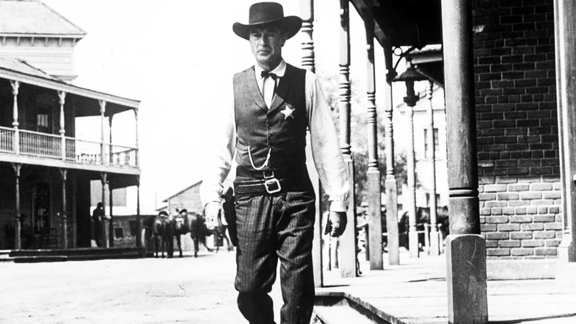 Gary Cooper walks down the city street in High Noon